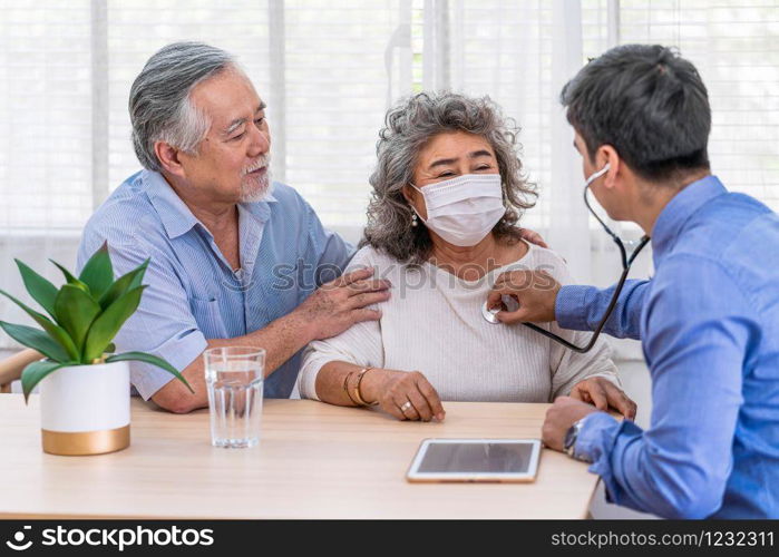 Doctor using stethoscope for auscultate Asian grandparent patient in house, service Life insurance at home, healthcare with Long live and Elderly society, Prevent epidemic concept