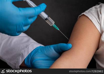 Doctor vaccinates child to stop coronavirus and other pandemic diseases. doctor vaccinates child