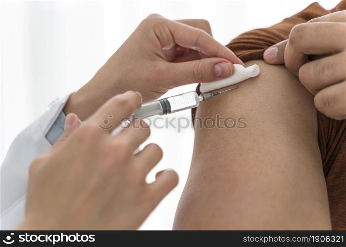 doctor vaccinating man close up. High resolution photo. doctor vaccinating man close up. High quality photo