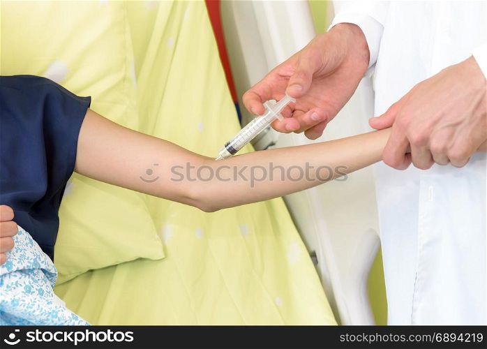 Doctor vaccinating patient using the syringe in hospital, Medical healthcare concept, selective focus