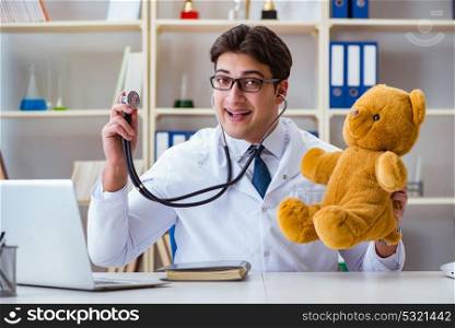 Doctor veterinary pediatrician holding an examination in the off. Doctor veterinary pediatrician holding an examination in the office with a teddy bear