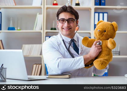 Doctor veterinary pediatrician holding an examination in the off. Doctor veterinary pediatrician holding an examination in the office with a teddy bear