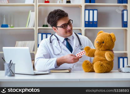 Doctor veterinary pediatrician holding an examination in the off. Doctor veterinary pediatrician holding an examination in the office with a teddy bear