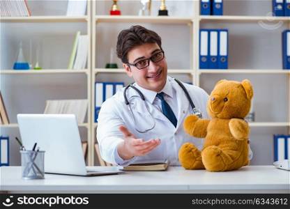 Doctor veterinary pediatrician holding an examination in the off. Doctor veterinary pediatrician holding an examination in the office with a teddy bear