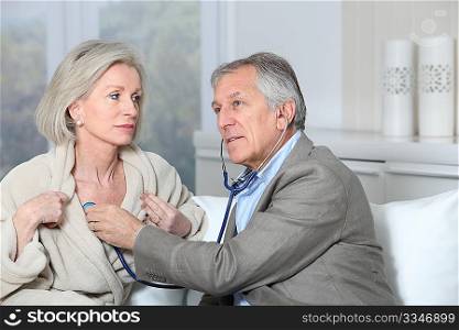Doctor visiting patient at home