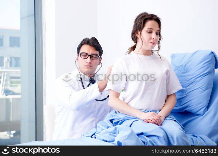 Doctor visiting patient in hospital room