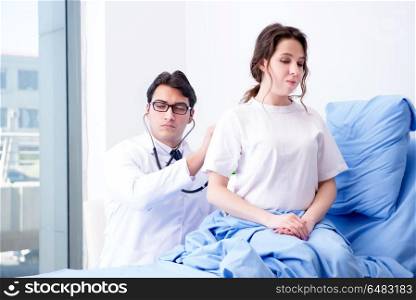 Doctor visiting patient in hospital room
