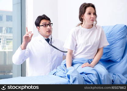 Doctor visiting patient in hospital room