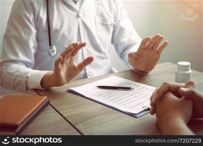 Doctor was explaining about the treatment to the patient and told him not to worry about getting sick.