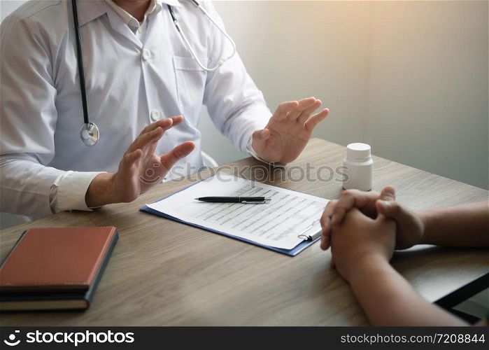 Doctor was explaining about the treatment to the patient and told him not to worry about getting sick.