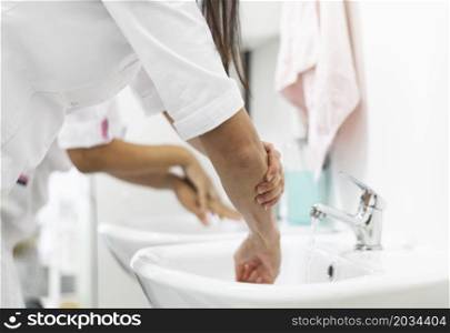 doctor washing hands clinic