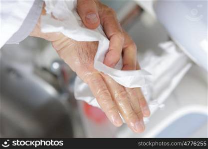 doctor washing hands under running water