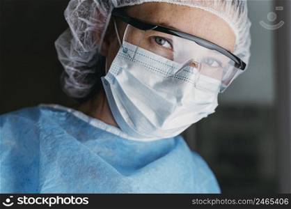 doctor wearing face mask protective goggles 2