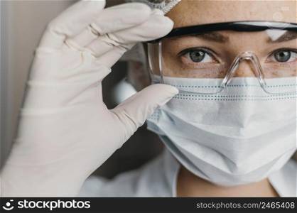doctor wearing face mask protective goggles