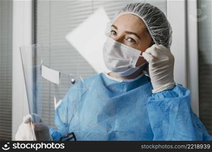 doctor wearing virus prevention equipment