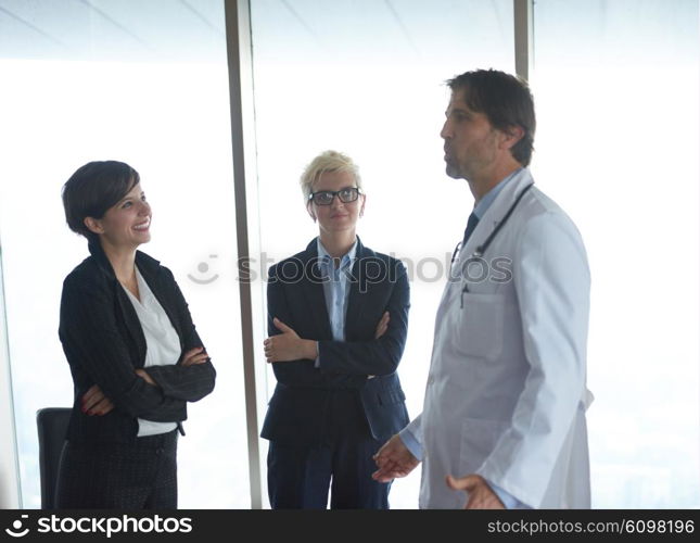 doctor with a patient family at bright modern office in hospital