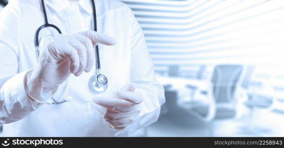 Doctor with a stethoscope in the hands and office background