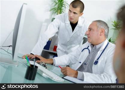 doctor with apprentice during consultation
