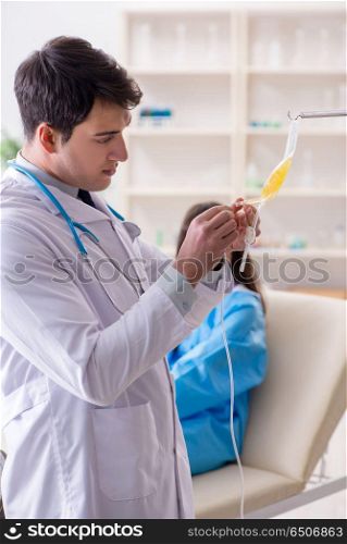 Doctor with bag of blood plasma in hospital