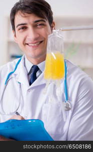 Doctor with bag of blood plasma in hospital