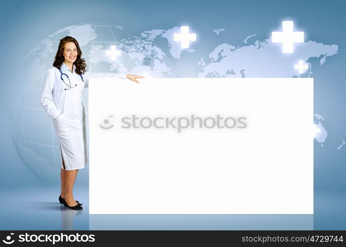 Doctor with banner. Image of young female doctor with blank banner. Place for text