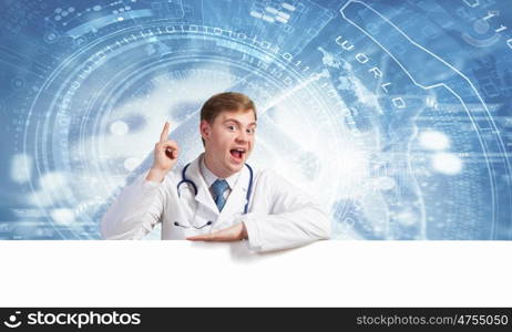 Doctor with banner. Young doctor with white blank banner. Place for text