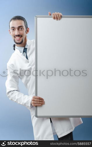 Doctor with blank message board