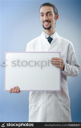 Doctor with blank message board