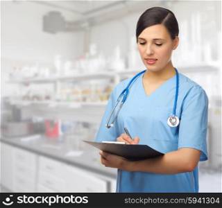 Doctor with clipboard at lab