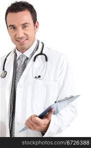 Doctor with clipboard smiling