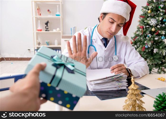 Doctor with gift box in the hospital