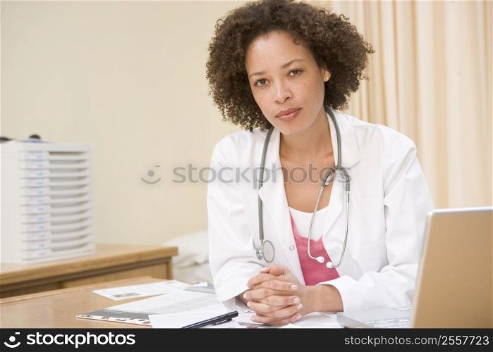 Doctor with laptop in doctor&acute;s office