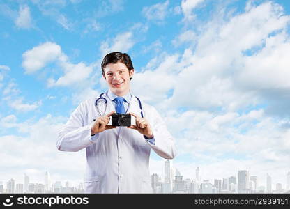 Doctor with photo camera