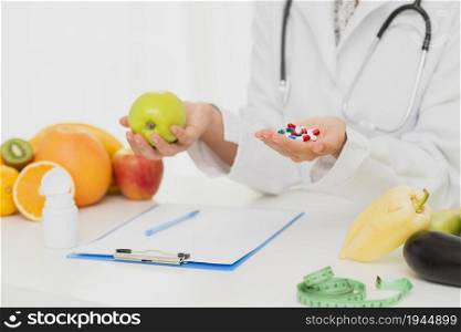 doctor with pills fresh fruits. High resolution photo. doctor with pills fresh fruits