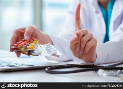 Doctor with prescribed medicines in medical concept