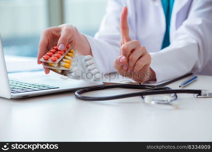 Doctor with prescribed medicines in medical concept