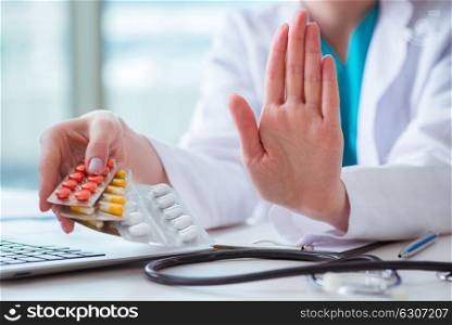 Doctor with prescribed medicines in medical concept. The doctor with prescribed medicines in medical concept