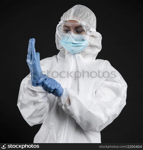 doctor with putting surgical gloves