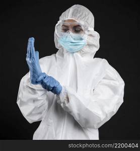 doctor with putting surgical gloves