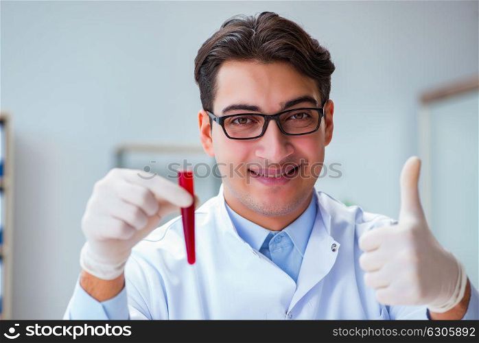 Doctor with red blood sample