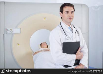 Doctor with stethoscope in front of MRI scan machine