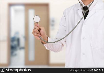 doctor with stethoscope in hospital background