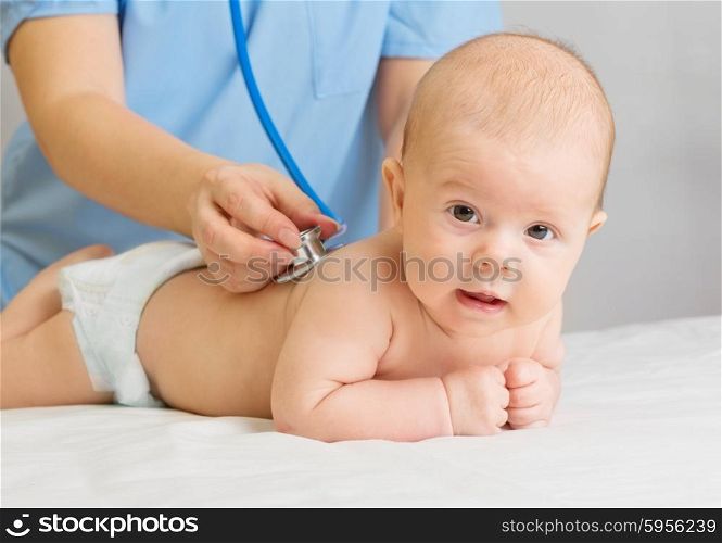 Doctor with stethoscope listen little baby