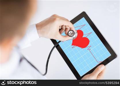 doctor with stethoscope listening heart beat on tablet pc