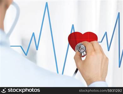 doctor with stethoscope listening heart beat on virtual screen. doctor listening to heart beat