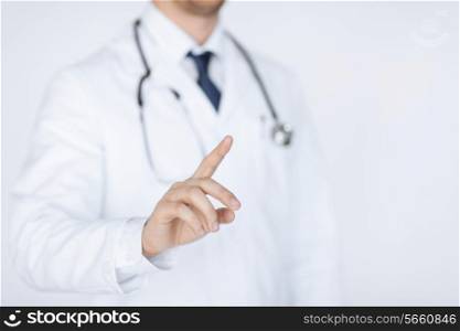doctor with stethoscope working with virtual screen