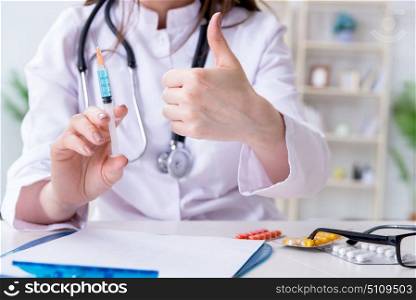 Doctor with syringe in the hospital