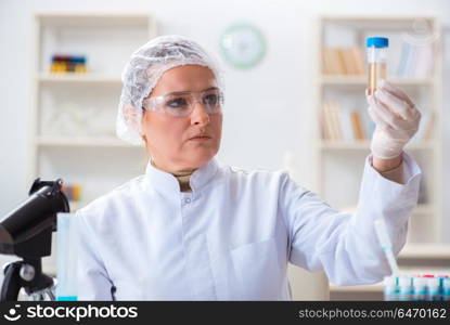 Doctor with test tube in medical hospital lab