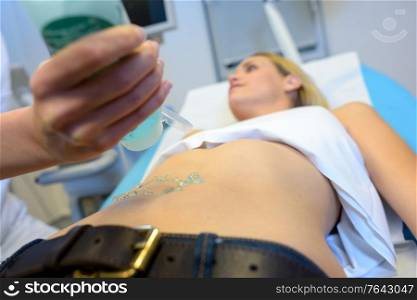 doctor with ultrasound scan woman belly