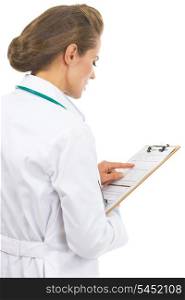 Doctor woman checking clipboard